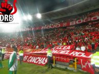 Foto: Barra: Disturbio Rojo Bogotá • Club: América de Cáli